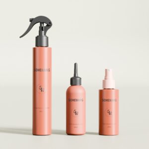 Three peach-colored SOMEWANG hair product bottles on a light surface feature unique caps: spray, nozzle, or pump.