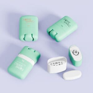 Four pastel green and white "SOME WANG" deodorant containers, two open, on a light purple surface.