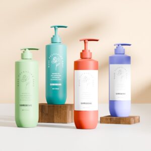 Set of four 750ml PE bottles with PP pumps in green, teal, coral, and lavender—ideal for conditioner or body cream.