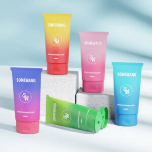 Five 120ml SOMEWANG D45 oval LDPE tubes with flip-top caps and branded labels are arranged on white blocks.