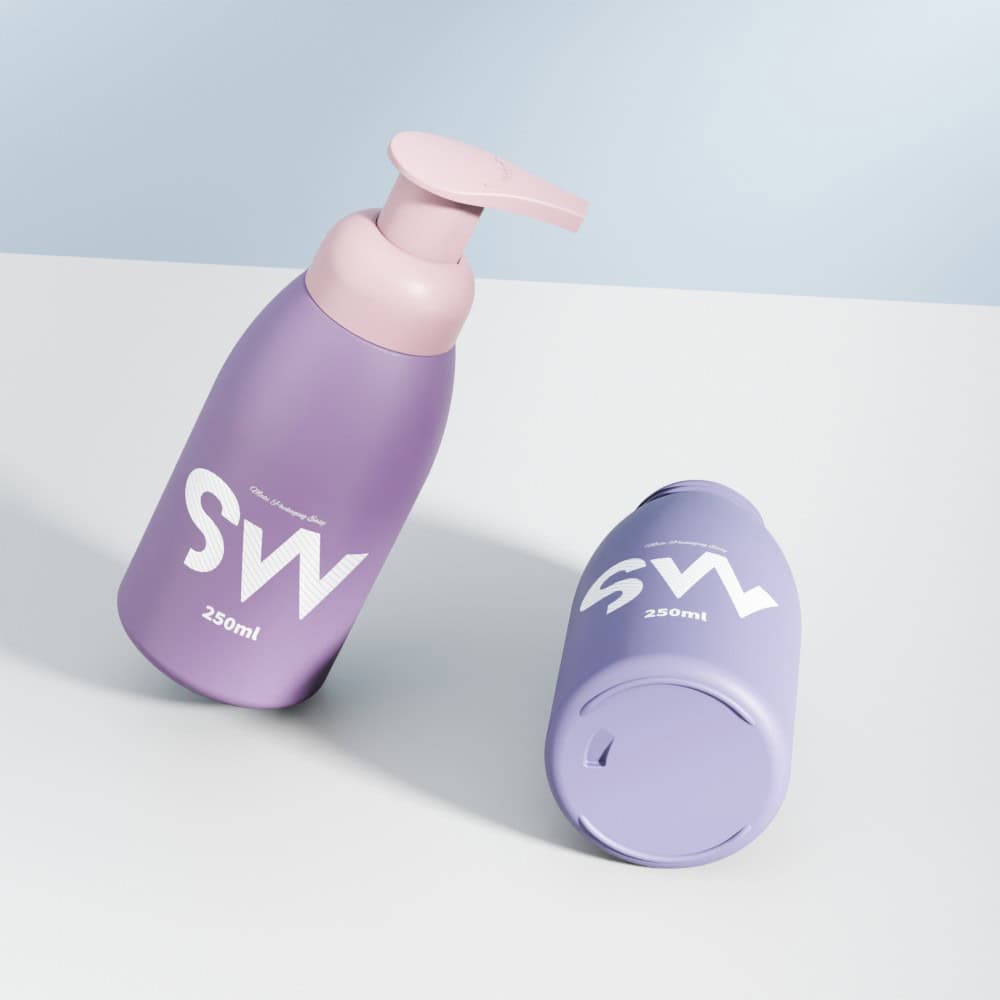 Two lavender 250ml HDPE foam bottles with pink pumps sit on a white surface, one upright and one lying down.