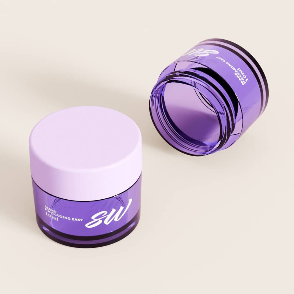 Two purple cosmetic jars, one upright and one on its side, on a beige background.