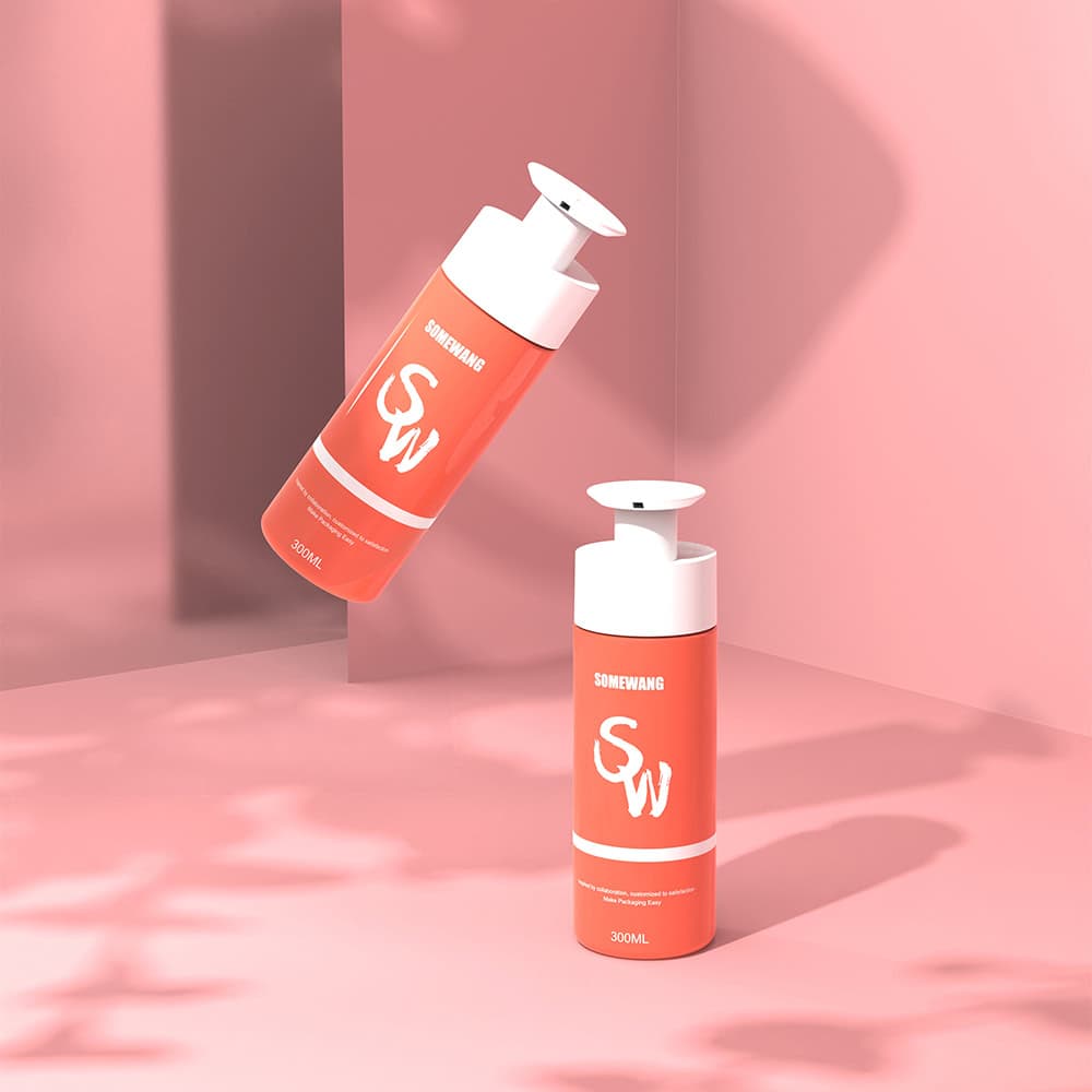 Two coral "SOMEWANG" pump bottles, one upright and one floating, on a pink background with soft shadows.