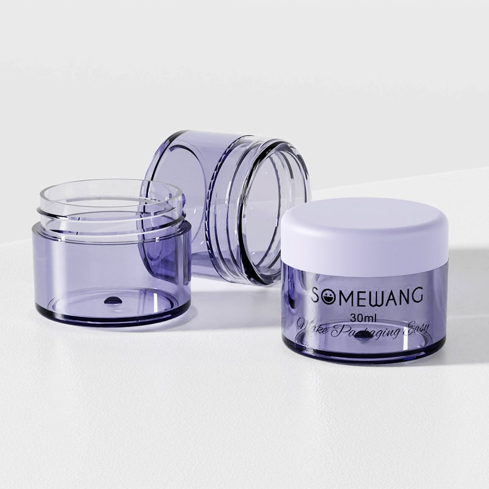 Three small transparent purple cosmetic containers with white lids, labeled "SOMEWANG 30ml," are placed on a white surface.